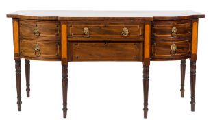 Of Royal Interest - A Regency mahogany and satinwood inlaid sideboard:, of bowed breakfront outline,