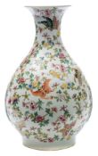 A Chinese famille rose bottle vase: of pear shape, painted overall with butterflies, fruit,