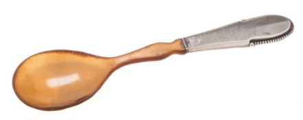 A Georg Jensen silver and horn beaded pattern spoon, assay master Christian F.