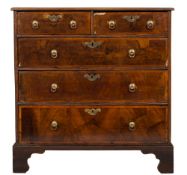 An early 18th Century walnut and oak diagonally crossbanded chest:,