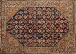 A Feraghan rug:, the indigo field with a Mina Khani geometric lozenge and medallion design,