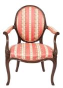 An 18th Century carved mahogany open armchair:, in the French Hepplewhite taste,