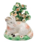 A Derby model of a recumbent ram: on mound base with bocage background, circa 1765-70,