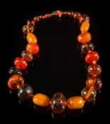 A multi-coloured amber bead, single-string necklace: with 28 round, oblong and faceted beads,