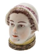A Chelsea bonbonniere: in the form of a lady's head with brown hair and four patches,