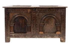 A 17th Century oak rectangular coffer:, with a plain twin moulded panel hinged top,