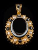 A late 19th century gold banded agate and seed pearl oval mourning pendant: with central oval agate