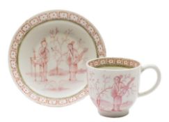 A Lowestoft coffee cup and saucer: painted in pink monochrome with two Chinese figures in a garden,
