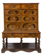 A late 17th Century walnut and cross and feather banded chest on later stand:,