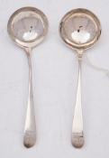 A pair of George III Old English sauce ladles, maker Hester Bateman, London, 1783: crested, 17.5cm.