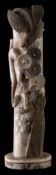 A Japanese carved ivory okimono: of a pine tree with a toad, serpent and eagle,