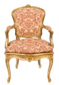 A 19th Century carved giltwood fauteuil:, in the Louis XV taste,