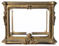 A 19th century ormolu and bevelled glass tiara display casket: of rectangular outline,