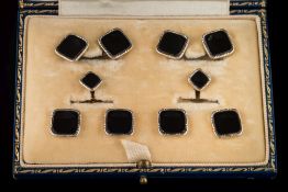 A suite of platinum-faced 14ct gold and black onyx panel cuff-links,