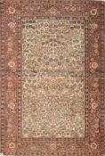 A Teheran rug:, the beige field with all over designs of flowering trees and plants,