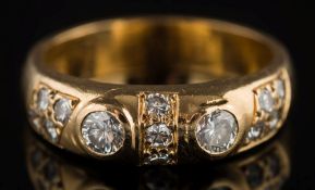 An 18ct gold and diamond thirteen-stone ring: with two circular,