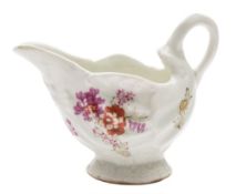 A Lowestoft creamboat: of 'Dolphin Ewer' form, painted in 'Curtis' style with floral sprays,