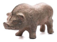 A Chinese grey pottery figure of a boar: standing with head slightly lowered, with spinal crest,