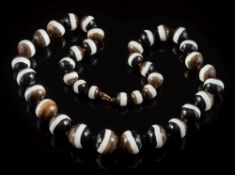 A banded agate bead, single-string necklace: with 38 individually knotted,