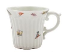 An early Worcester ribbed coffee can: of lobed form and scroll handle,