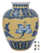 A Chinese underglaze blue and yellow-ground jar: of ovoid form with short waisted neck and rolled