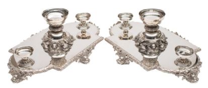 A pair of silver plated table centrepieces: of lozenge -shaped outline,