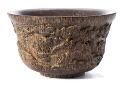 A Chinese carved hardwood bowl: decorated with cranes amongst pine trees,