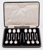 A set of twelve George VI silver teaspoons and tongs, maker Cooper Brothers & Sons Ltd, Sheffield,