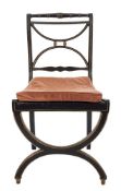 An unusual Regency ebonised and gilt decorated side chair:,