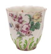 A Chelsea spirally-moulded beaker: the lower part with bright green and pink leaves,