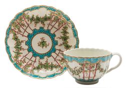 A First Period Worcester 'Hop Trellis' cup and saucer: of fluted form,