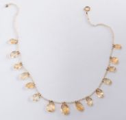 A graduated citrine and seed pearl fringe necklace:, 10gms gross weight.