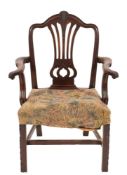 A George III mahogany elbow chair:, in the Hepplewhite taste,