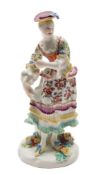 A Derby figure of a dancing lady: holding a posy in her left hand and the folds of her skirt in the