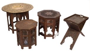 An Indian carved wood and brass inlaid octagonal table:, on a fixed stand,