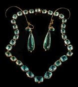 A pair of gold and aquamarine coloured paste-set drop earrings: and matching necklace.