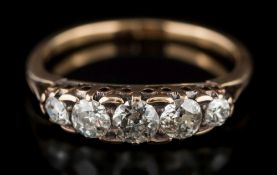 A gold and diamond five-stone ring: with graduated,