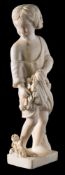 A 19th century European carved ivory figure of a young girl: holding flowers in the folds of her