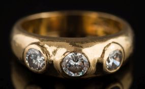 An 18ct gold and diamond three-stone ring: with circular old European-cut and brilliant-cut
