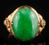 A jade mounted, single-stone ring: the oval jade 15.7mm long x 12.
