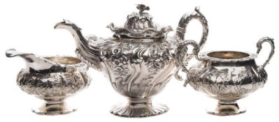 A matched early 19th century silver three-piece tea service: the teapot with maker's marks for J B