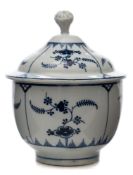 A Lowestoft blue and white sucrier and cover: with flower bud finial,