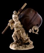 A fine Japanese ivory and boxwood okimono of Nio slaying oni demons: carrying a carved hardwood