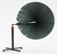 A 19th century portable folding face screen: the green silk cockade leaf mounted on a gilt brass