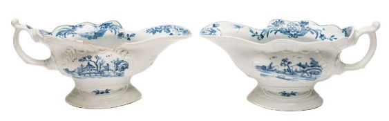 A pair of First Period Worcester blue and white high-footed sauceboats: each of silver shape with