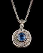 A sapphire and diamond circular pendant: the central sapphire approximately 5.