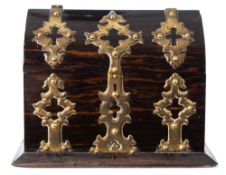 A Victorian coromandel wood and brass mounted box: of arched outline,
