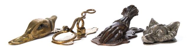 A Victorian brass paper clip in the form of a duck's head: with inset glass eyes, 16cm.
