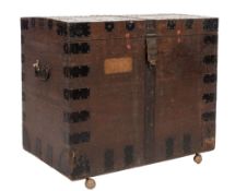 An oak and metal bound domed chest:, with a hinged top,