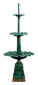 A cast iron three-tier fountain: with three graduated circular bowls on a foliate decorated and